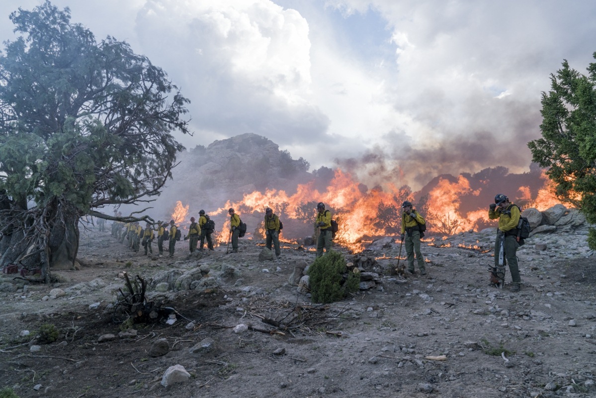 The Granite Mountain Hotshots save the alligator juniper tree by lighting a backburn in Columbia Pictures' ONLY THE BRAVE.